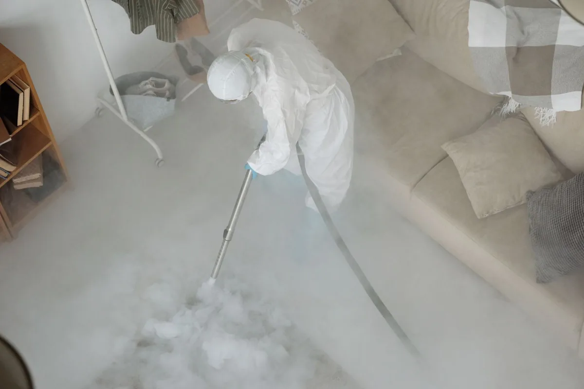 Biohazard cleanup technician in protective equipment, Reiffton, PA
